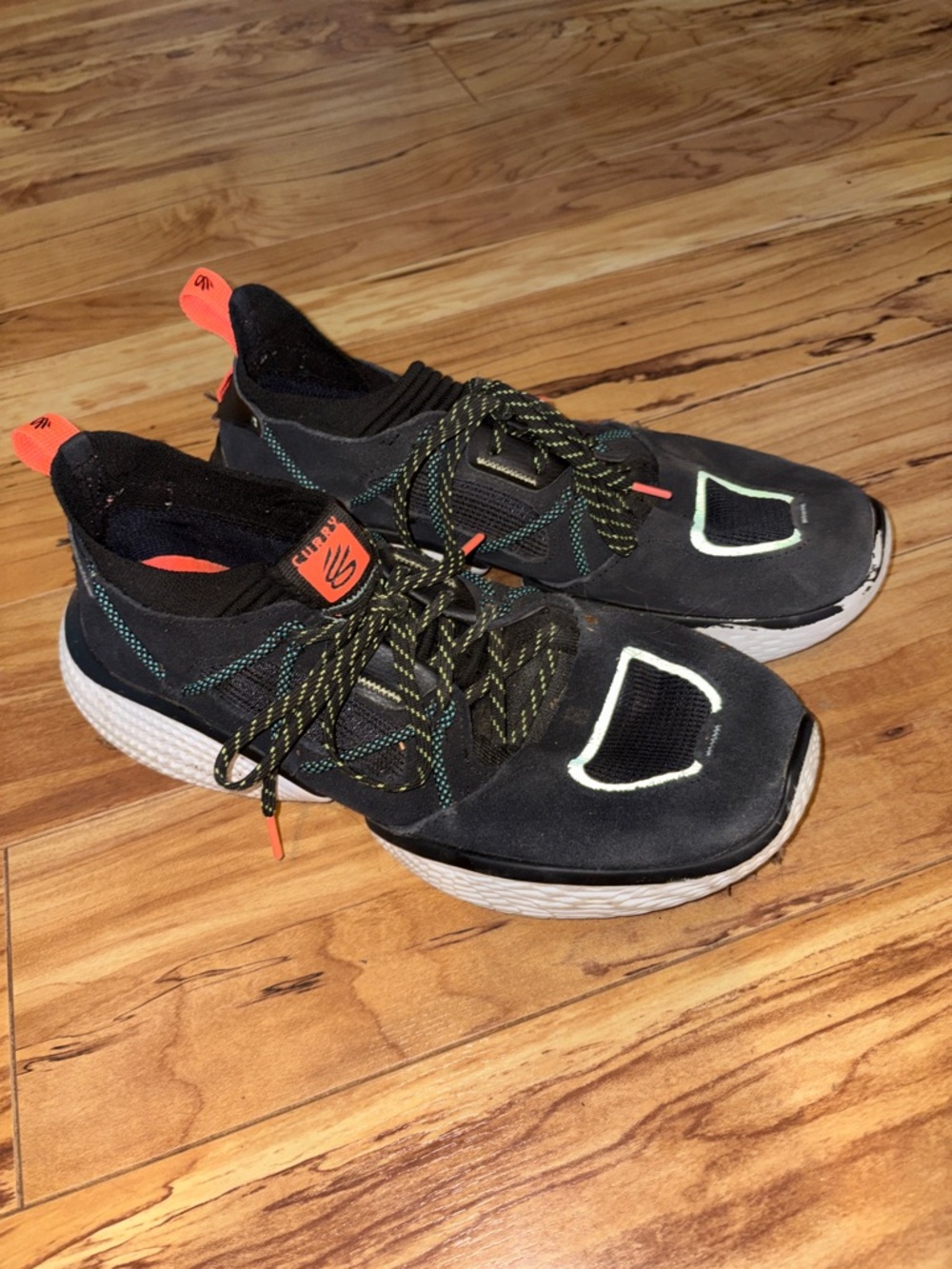Steph Curry Black Athletic Sneakers with Neon Orange Accents